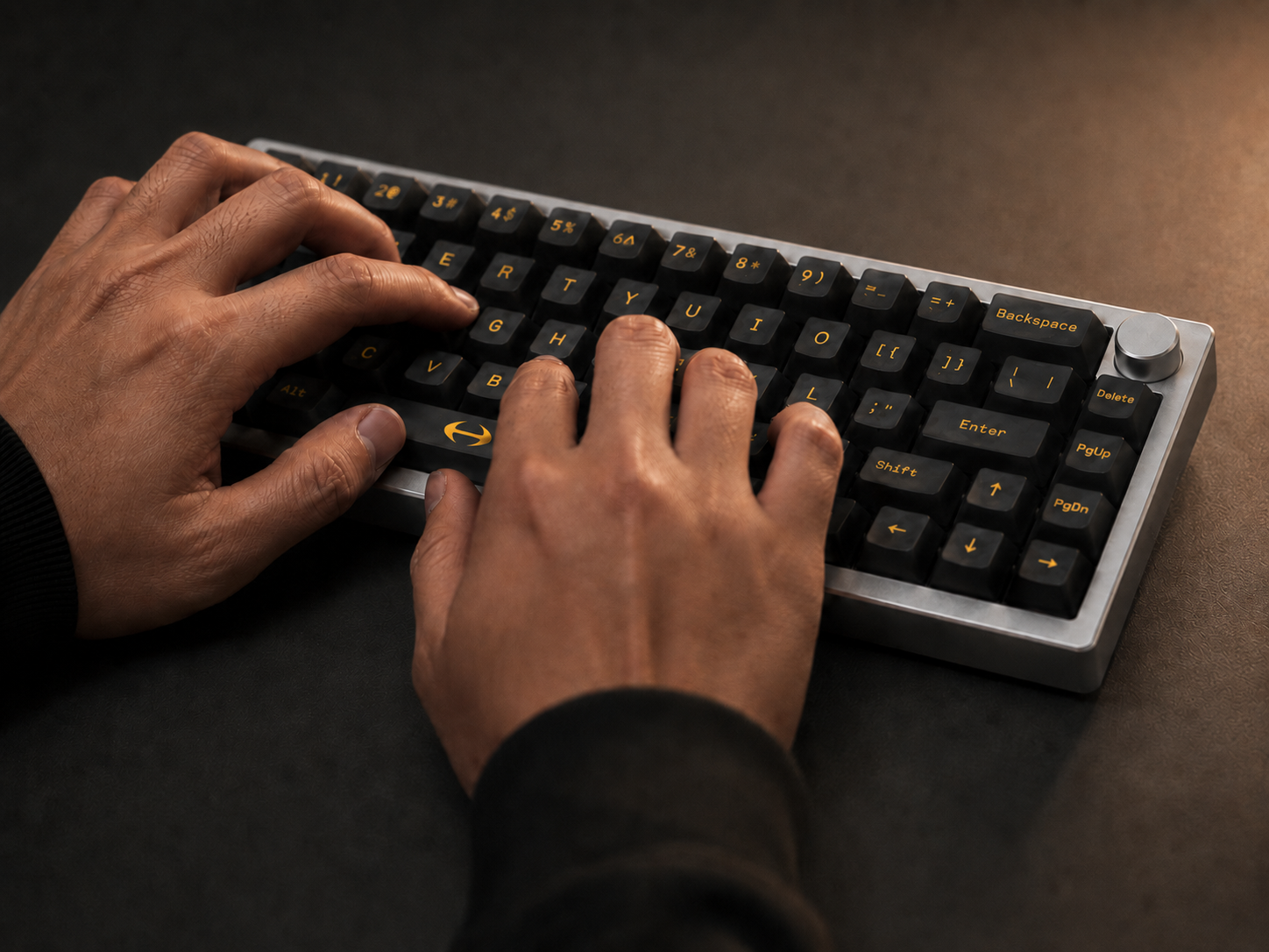 Hands typing on the Canary C01