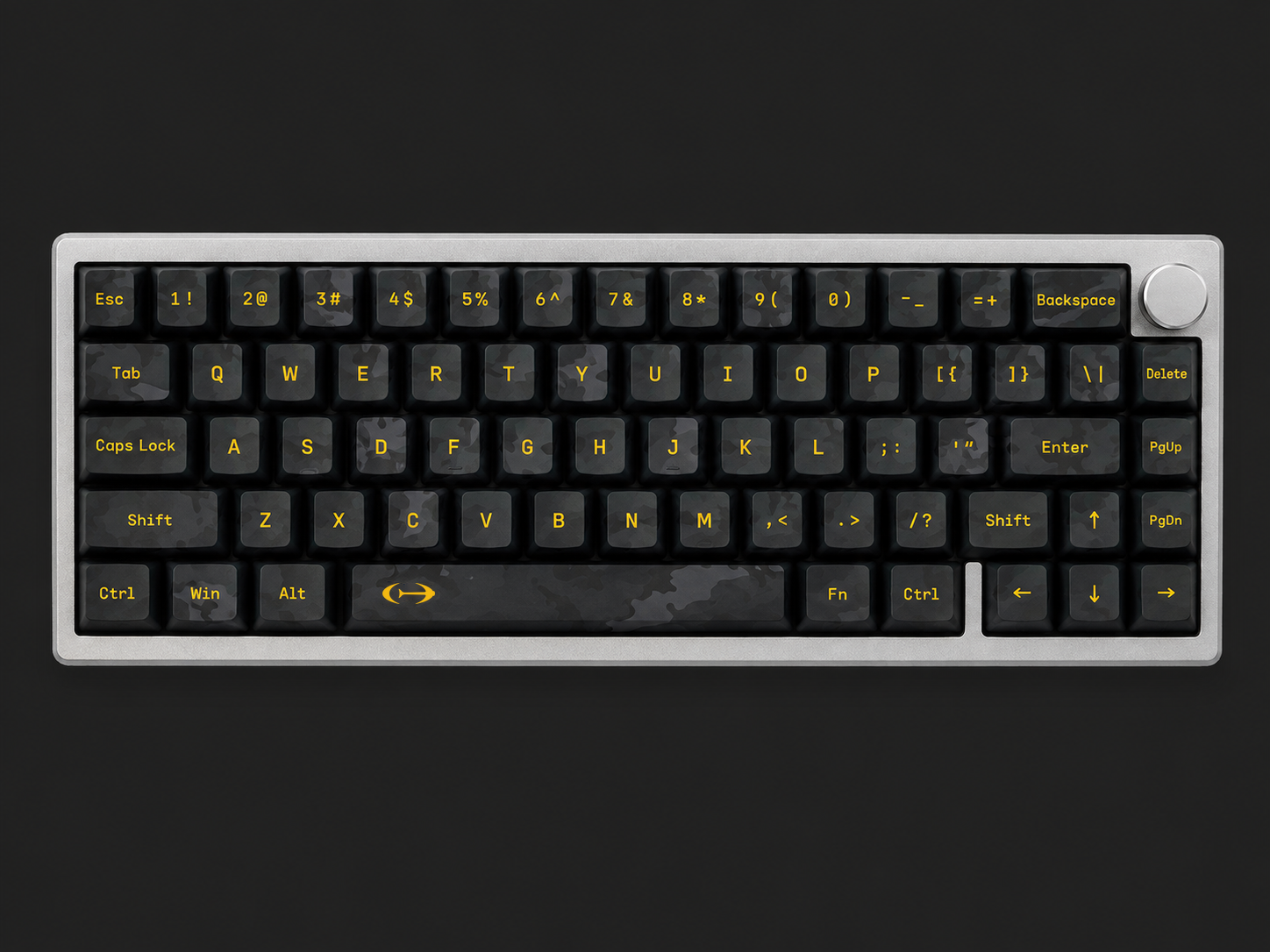 Canary C01 65% keyboard, straight-on: black camo keycaps with canary-yellow legends in a silver die-cast case, rotary knob top right